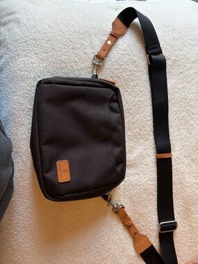 Charcoal Crossbody Bag with Tan Accents by Nordace like new